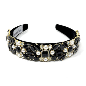 Elegant black headband adorned with clusters of white pearls and black crystals, creating a luxurious and sophisticated look.