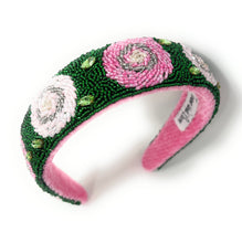 Load image into Gallery viewer, Statement floral headband showcasing detailed rose designs, green leaf accents, and luxurious handcrafted beadwork.