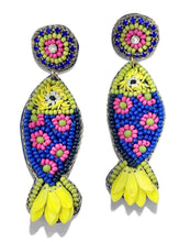 Load image into Gallery viewer, Handmade beaded fish earrings featuring vibrant floral patterns in blue, pink, green, and yellow for a playful coastal look.