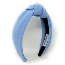 Load image into Gallery viewer, Woman accessorized with a soft blue fabric headband and artisan bird-shaped earrings, creating a playful yet sophisticated look.