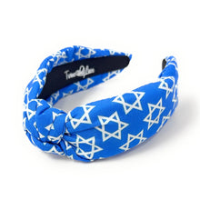 Load image into Gallery viewer, A blue fabric headband with a white Star of David pattern, featuring a knotted twist detail on the front. The brand name 'Twine and Love' is printed in white on the inner black lining.