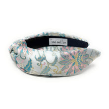 Load image into Gallery viewer, Floral patterned headband on a white background