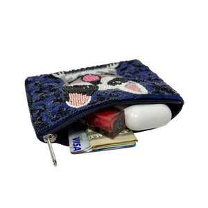 Blue sequin purse with a beaded French bulldog design. The dog has a playful expression and a light pink tongue, adding a fun, cheerful tone.