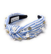 Load image into Gallery viewer, A stylish headband with blue and white stripes, adorned with pearls and sparkling gems. It has a knotted design, offering a chic and elegant look.
