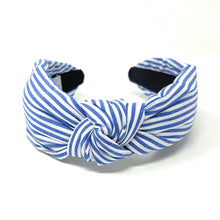 Load image into Gallery viewer, Blue and white striped headband with a knotted detail in the center, set against a plain white background, conveying a trendy, nautical style.