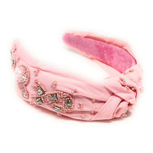 Load image into Gallery viewer, Handcrafted pink awareness ribbon earrings styled with a soft pink embellished headband and classic white ribbed top.