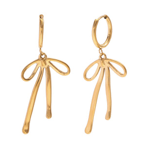 Gold earrings with abstract bow shapes and dangling elements. The design is modern and elegant, suggesting a stylish and artistic flair.