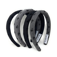 Load image into Gallery viewer, Four fabric headbands with bow patterns, alternating in black and gray, are stacked in a semi-circle on a white background.