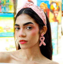 Load image into Gallery viewer, Breast cancer awareness statement earrings designed as pink ribbons with intricate beadwork and lightweight construction.
