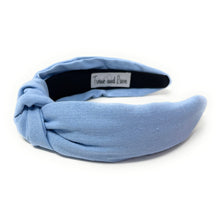 Load image into Gallery viewer, Classic light blue knot headband crafted from textured fabric for a chic everyday look.