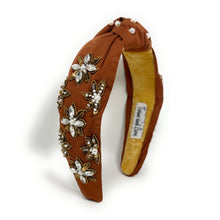 Load image into Gallery viewer, Brown headband adorned with pearl and crystal floral embroidery, exuding elegance. The interior is lined with soft beige fabric for comfort.