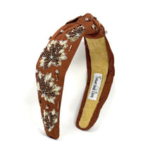 Load image into Gallery viewer, Brown headband with floral embellishments on a white background