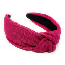 Load image into Gallery viewer, Fashion portrait featuring a bold hot pink headband, statement earrings, and an elegant black outfit.
