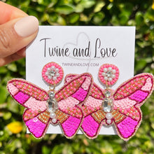 Load image into Gallery viewer, Pink butterfly statement earrings with sequins, pearl accents, and sparkling crystal embellishments.