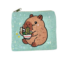 Load image into Gallery viewer, Cute capybara coin purse with a design of a capybara holding noodles.