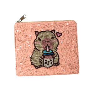 Sequined pouch with a beaded design of a capybara sipping bubble tea, featuring a small pink heart. Playful and whimsical vibe.