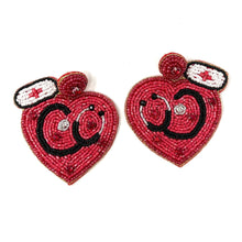 Load image into Gallery viewer, Red nurse heart statement earrings with embroidered stethoscope details and sparkling bead accents.