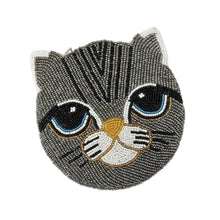 Load image into Gallery viewer, Beaded cat face with large blue eyes and a gray pattern. The intricate design features white ears and nose, and black whisker accents. Cute and whimsical.