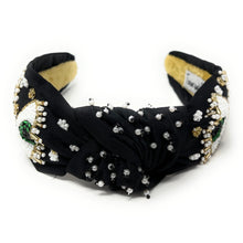 Load image into Gallery viewer, Elegant black padded headband with protective eye-inspired beadwork, gold crystals, and pearl accents.