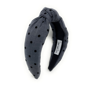 Charcoal Blue headband with black polka dots on a white background