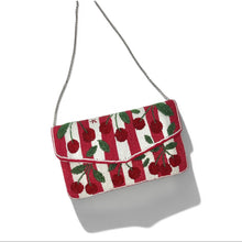 Load image into Gallery viewer, A small flap shoulder bag with a red and white cherry pattern, featuring green leaf details and a thin silver chain strap, shown on a white background with a soft shadow.