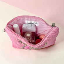 Load image into Gallery viewer, Bright pink mini clutch with intricate beadwork and decorative bow centerpiece.
