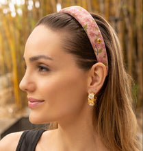 Load image into Gallery viewer, Model showcasing a floral patterned headband and gold earrings.