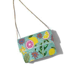 Load image into Gallery viewer, Handcrafted lemon garden beaded clutch with colorful citrus and floral design, aqua blue background, and intricate beadwork by Twine and Love.