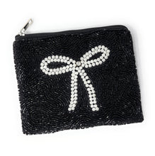 Load image into Gallery viewer, Small black beaded clutch with intricate texture and pearl bow detail.