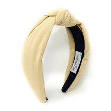 Load image into Gallery viewer, Beige linen knotted headband featuring a chic front twist design and a soft neutral tone, perfect for everyday styling.