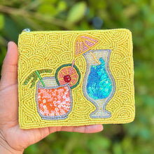 Load image into Gallery viewer, Hand beaded cocktail pouch with colorful martini glass and citrus drink design on a lime green beaded background.