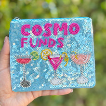 Load image into Gallery viewer, Light blue beaded pouch with “Cosmo Funds” text and colorful cocktail glasses, fully covered in sequins with zip closure.