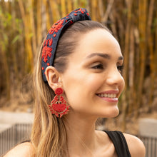 Load image into Gallery viewer, close-up of a woman with a stylish headband and red earrings smiling outdoors