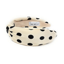 Load image into Gallery viewer, Cream-colored headband with black polka dots, featuring a twisted knot design. The brand tag reads &quot;Twine and Love,&quot; adding a touch of elegance.
