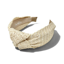 Load image into Gallery viewer, A woven straw-style twist-front headband in a natural cream color, shown on a clean white background with a soft shadow.