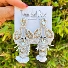 Load image into Gallery viewer, White beaded lobster dangle earrings with rhinestone details, lightweight design, and eye-catching sparkle.