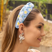 Load image into Gallery viewer, Handcrafted flower drop earrings with white petals, sparkling rhinestones, and delicate crystal embellishments in a luxe boho style