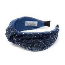 Load image into Gallery viewer, Blue denim headband with a knotted design, adorned with small white dots resembling sparkles. The fabric texture adds a casual yet chic touch.