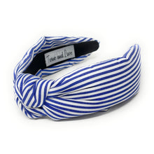 Load image into Gallery viewer, Blue and white striped headband with a knotted detail in the center, set against a plain white background, conveying a trendy, nautical style.