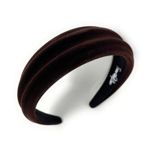 Load image into Gallery viewer, A brown, velvet headband with a wavy design. It has a luxurious appearance and classic style, set against a plain white background.