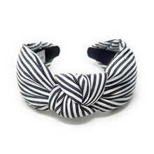 Load image into Gallery viewer, Black and white striped headband on a white background