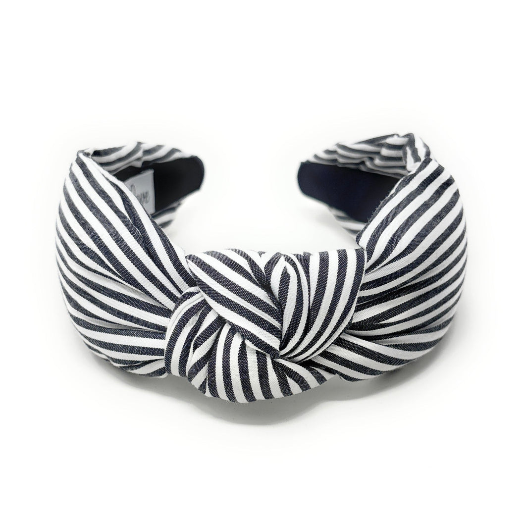 Black and white striped headband on a white background
