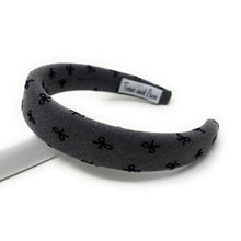 Load image into Gallery viewer, Gray headband with black bow pattern on a white background