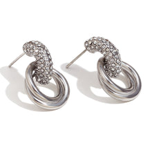 Load image into Gallery viewer, Pair of silver hoop earrings with embedded stones on a white background