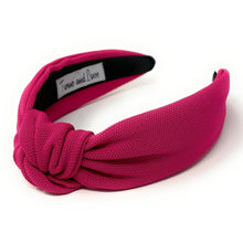 Load image into Gallery viewer, Fashion portrait featuring a bold hot pink headband, statement earrings, and an elegant black outfit.