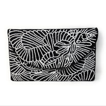 Load image into Gallery viewer,  Stylish black clutch bag with intricate white beadwork design