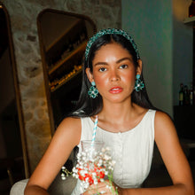Load image into Gallery viewer, Fashionable green headband showcased on a model enjoying a refreshing drink.