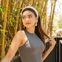 Load image into Gallery viewer, Statement earrings featuring ivory oval stones, sparkling rhinestones, and radiant gold-tone detailing.