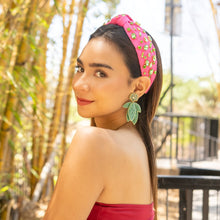 Load image into Gallery viewer, Tropical-inspired leaf drop earrings crafted with intricate green beads and gold-trimmed artisan detailing.