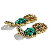 Load image into Gallery viewer, Handcrafted pineapple statement earrings showcasing intricate gold embellishments, vibrant green stones, and a tropical-inspired design.